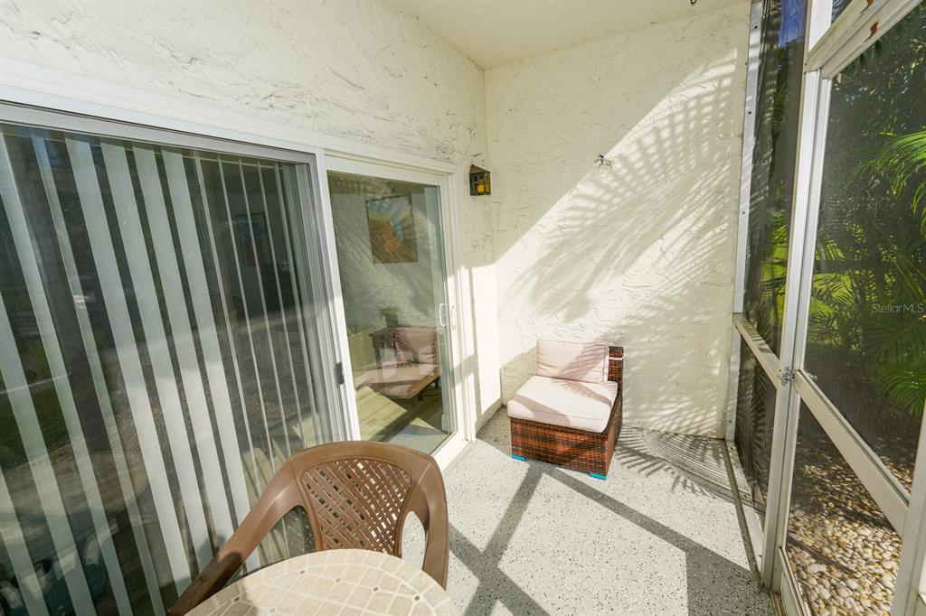 3251 South Beneva Road, Unit 101 Sarasota, FL 34232 - Photo 15 of 22 a living room with furniture and a gate