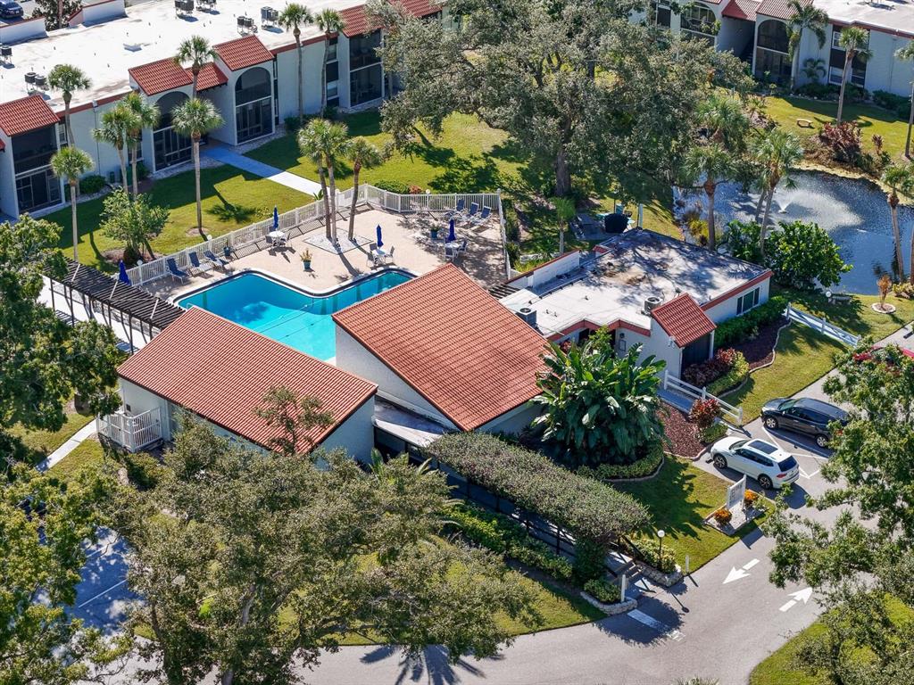 3251 South Beneva Road, Unit 101 Sarasota, FL 34232 - Photo 21 of 22 an aerial view of a house with a yard and lake view