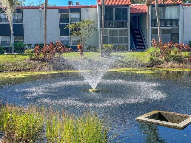 a view of swimming pool with a patio and garden