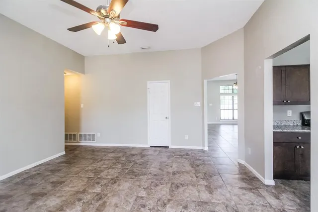 a view of an empty room with a window