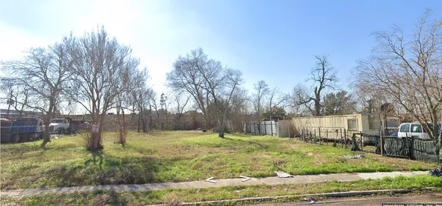 a swimming pool with outdoor seating and yard