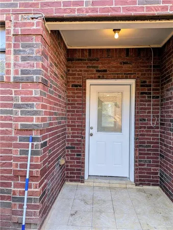 a view of a door of the house with an outdoor space
