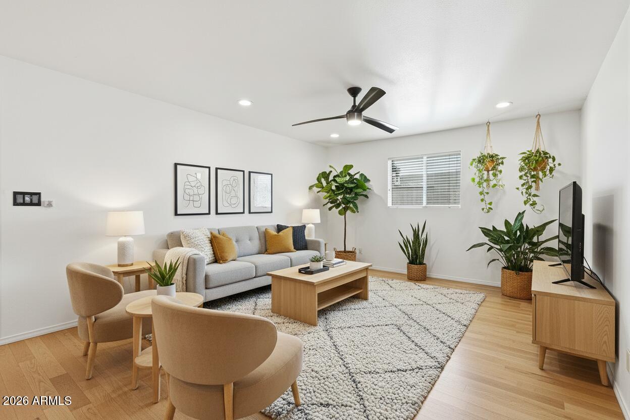 3830 East Shangri La Road Phoenix, AZ 85028 - Photo 12 of 53 a living room with furniture potted plant and a window