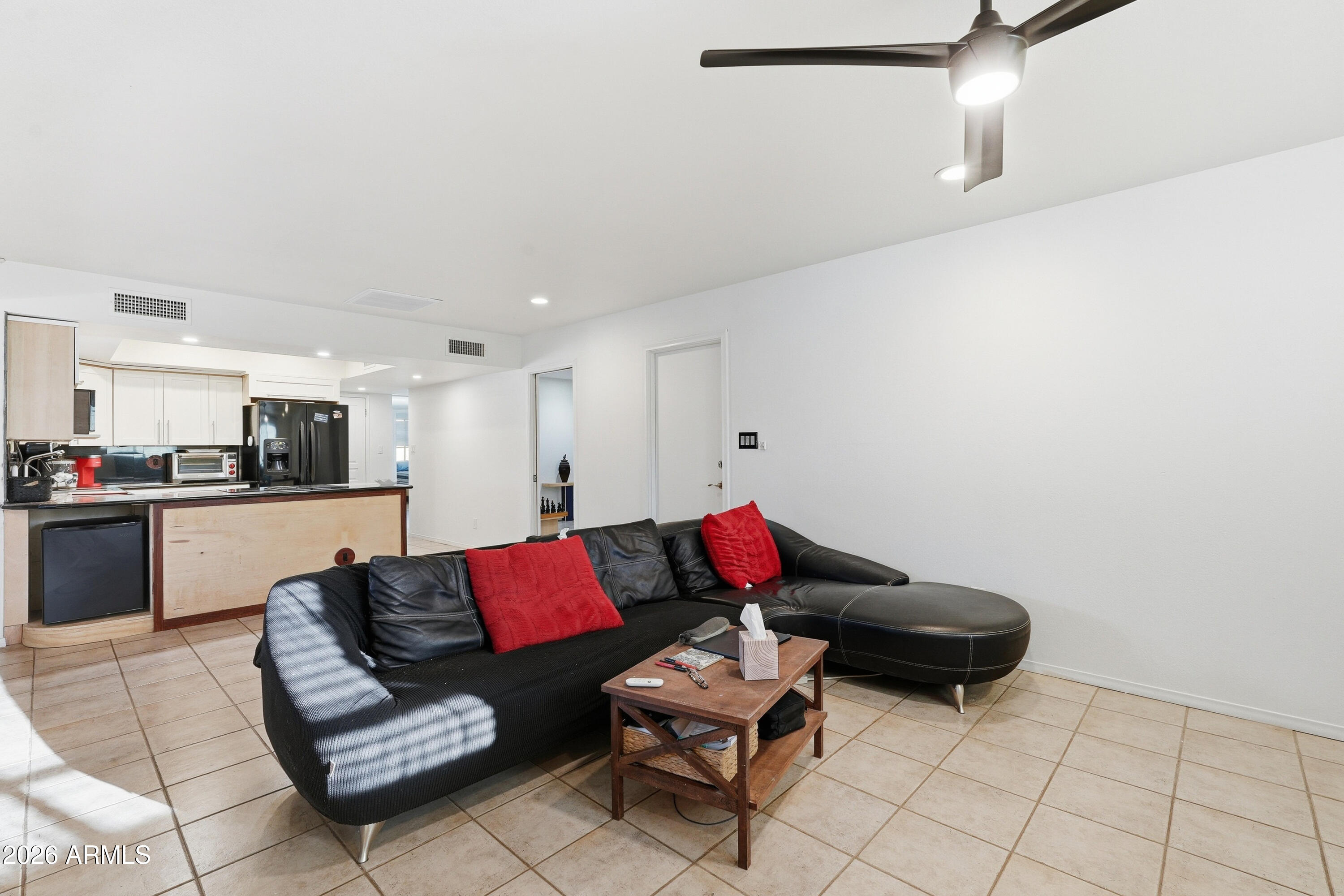 3830 East Shangri La Road Phoenix, AZ 85028 - Photo 14 of 53 a living room with furniture and kitchen view