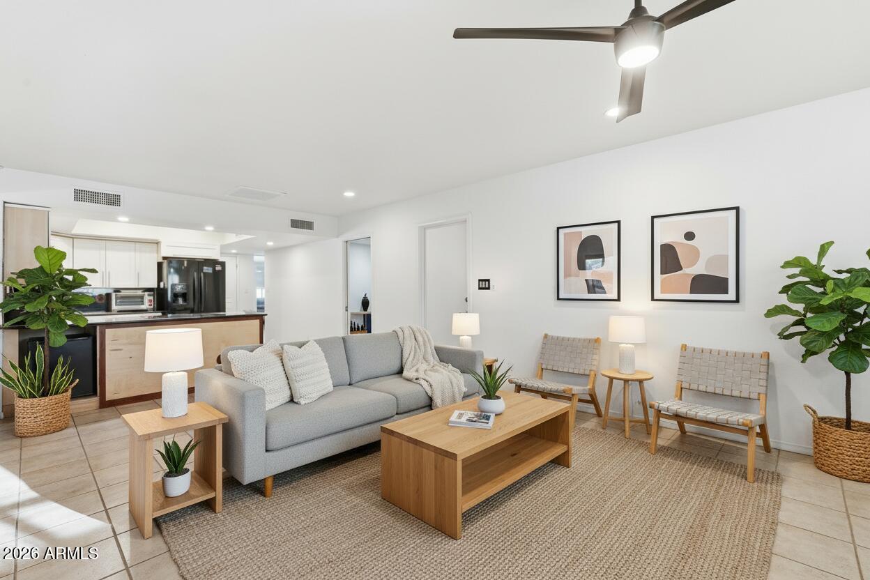 3830 East Shangri La Road Phoenix, AZ 85028 - Photo 15 of 53 a living room with furniture and a potted plant