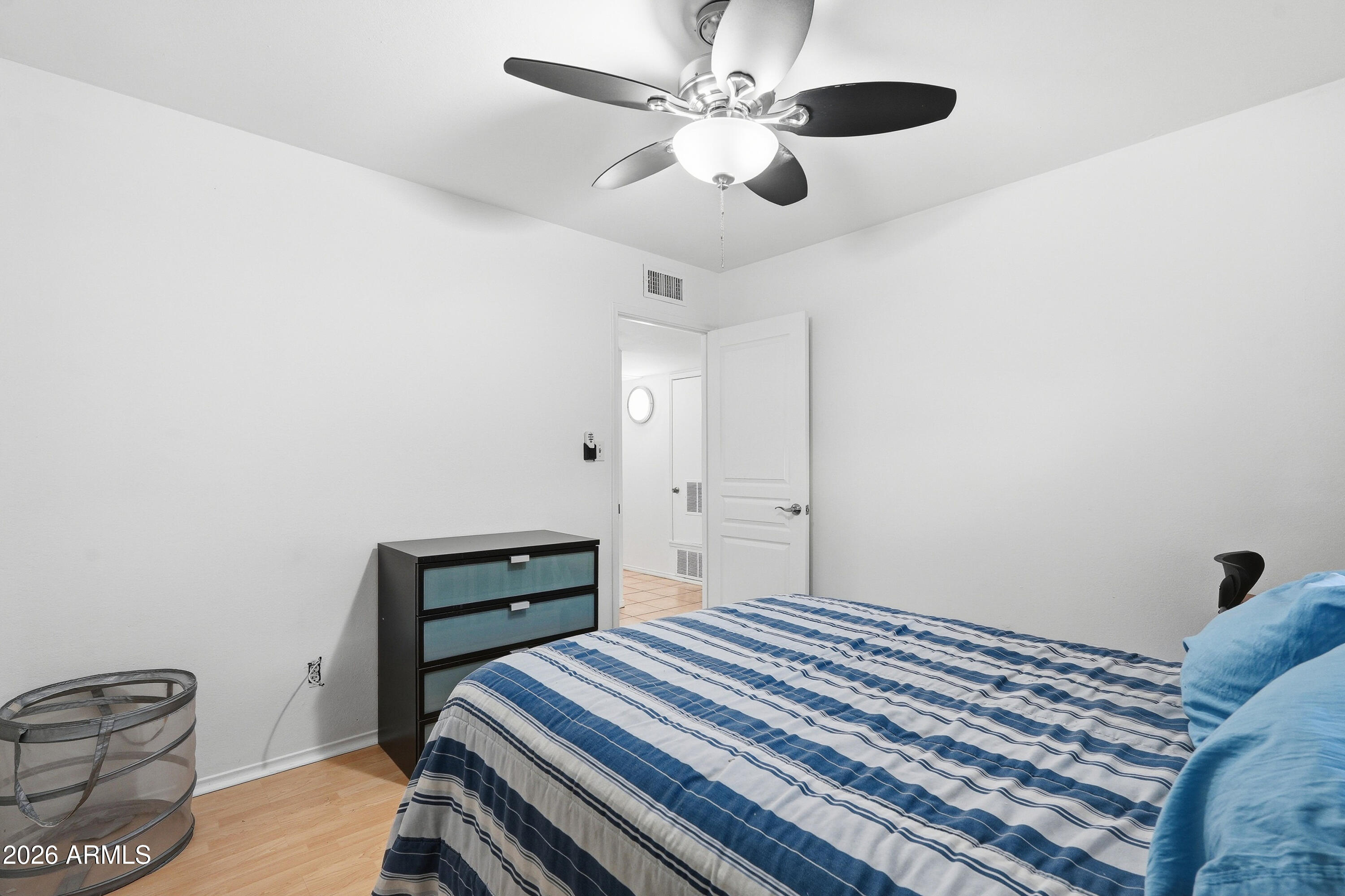 3830 East Shangri La Road Phoenix, AZ 85028 - Photo 32 of 53 a bedroom with a bed and a ceiling fan