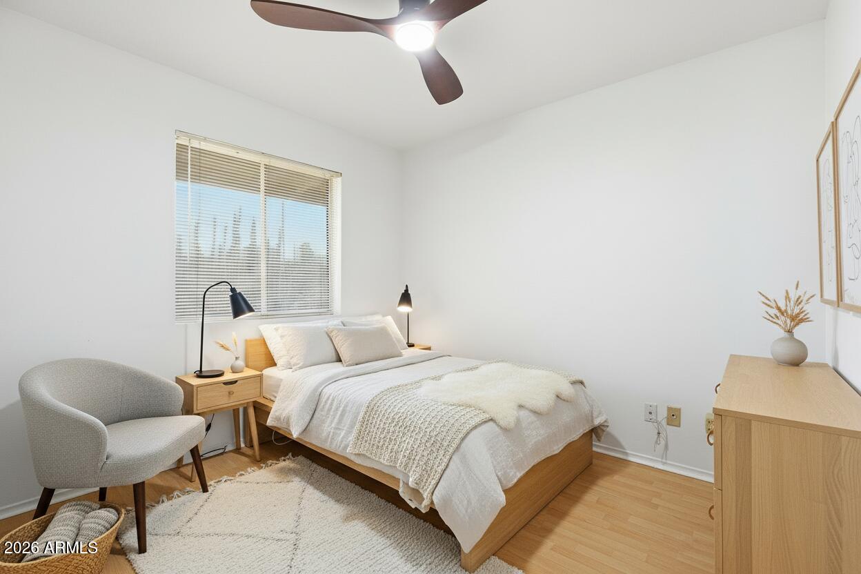 3830 East Shangri La Road Phoenix, AZ 85028 - Photo 34 of 53 a bedroom with a bed and a chair