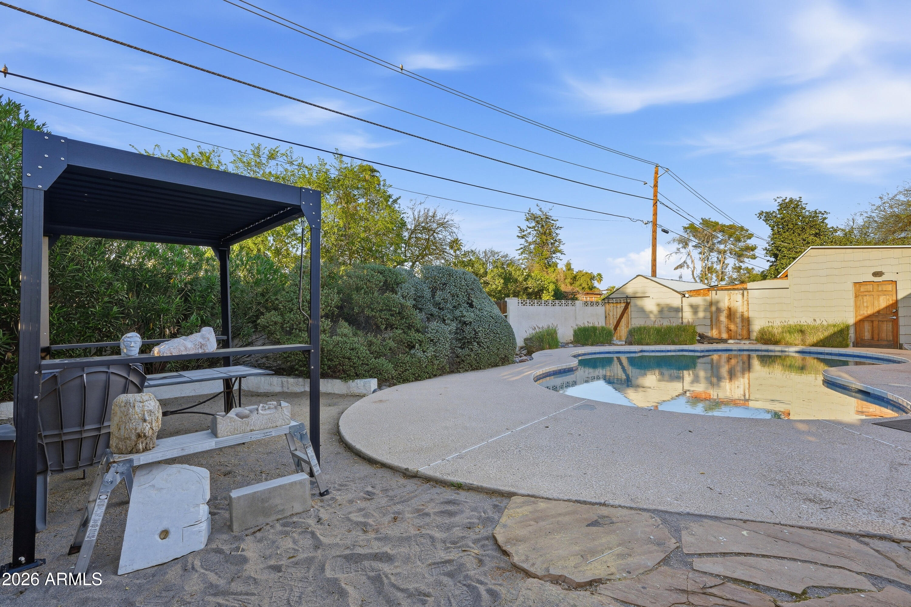 3830 East Shangri La Road Phoenix, AZ 85028 - Photo 49 of 53 a view of a swimming pool with a patio