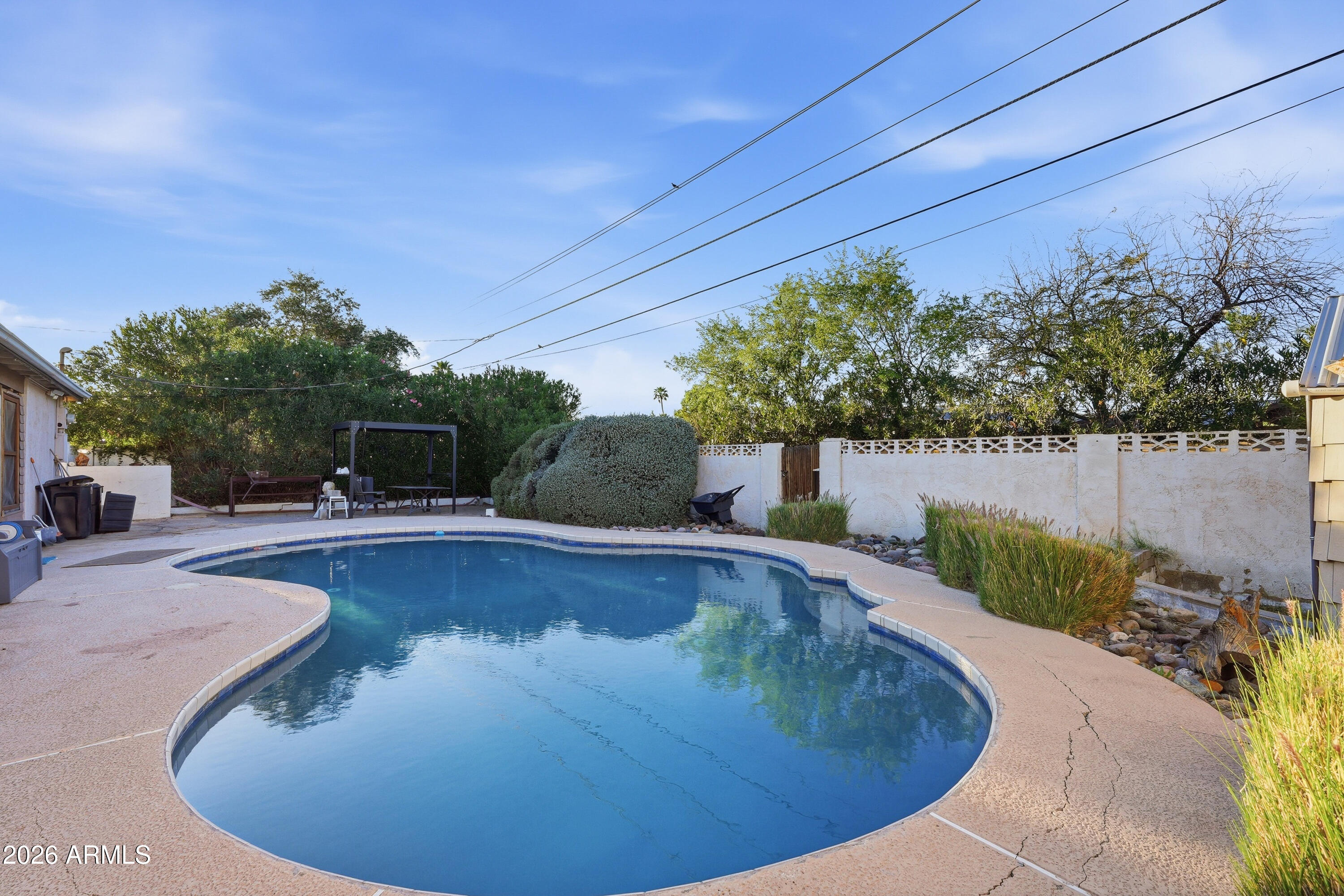 3830 East Shangri La Road Phoenix, AZ 85028 - Photo 50 of 53 a view of a swimming pool with a patio