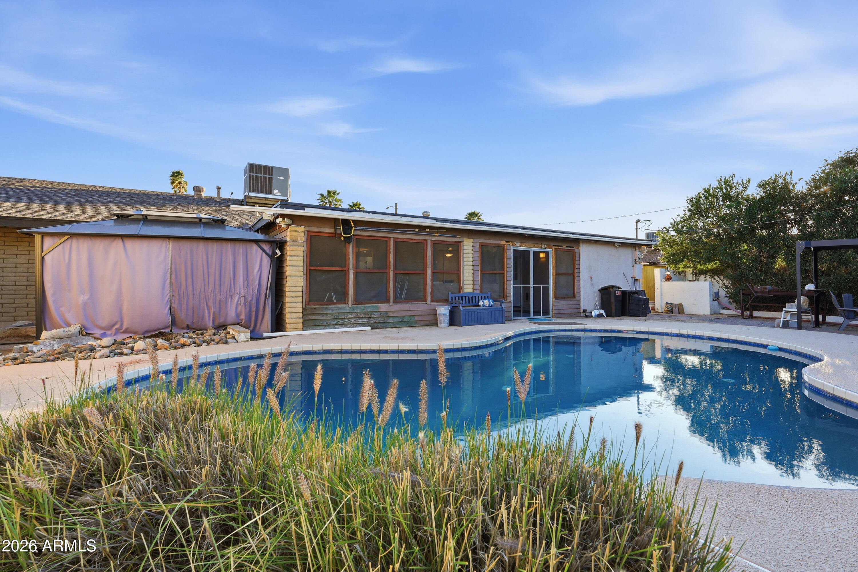 3830 East Shangri La Road Phoenix, AZ 85028 - Photo 51 of 53 a view of a house with pool and sitting area