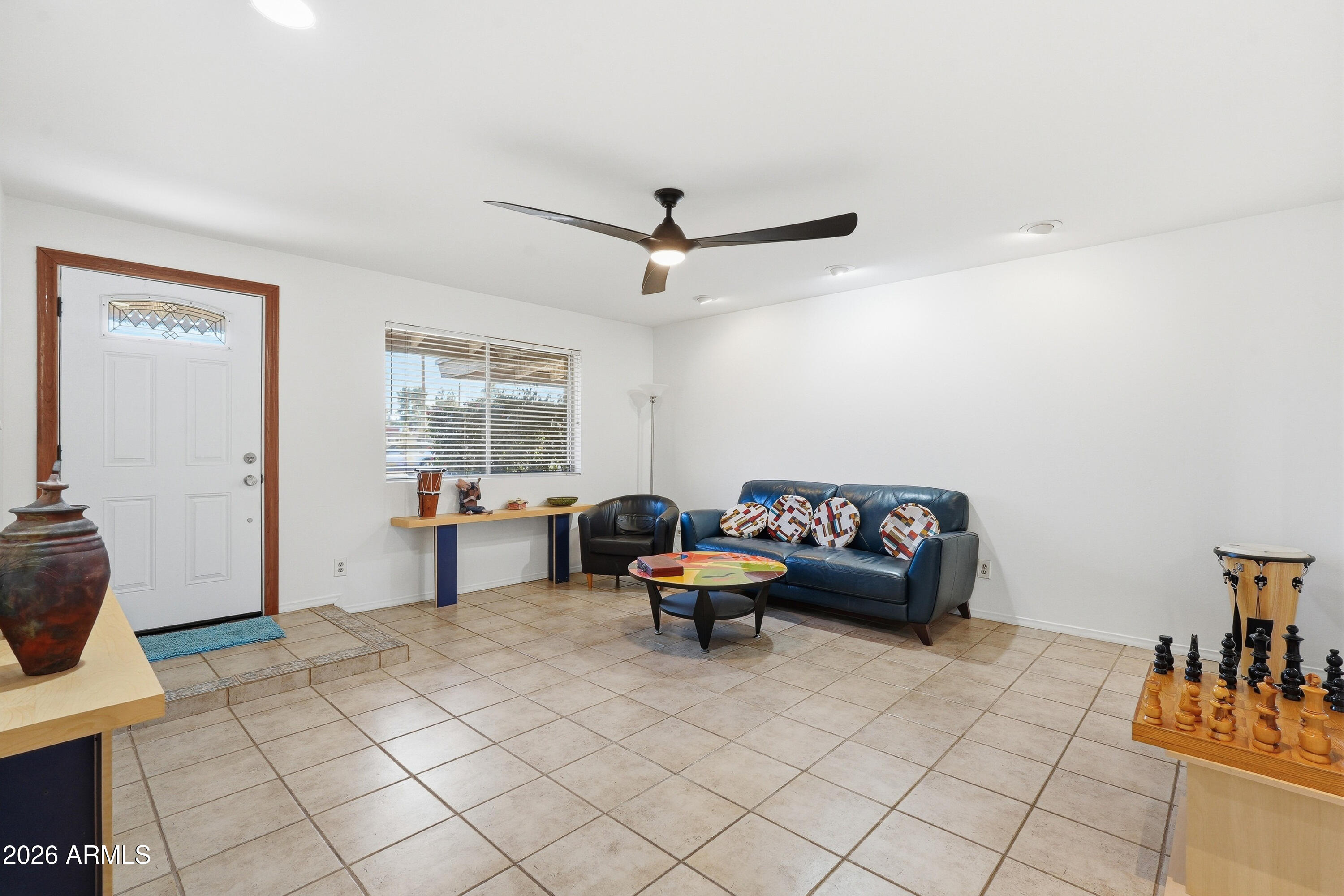 3830 East Shangri La Road Phoenix, AZ 85028 - Photo 7 of 53 a living room with furniture and a window