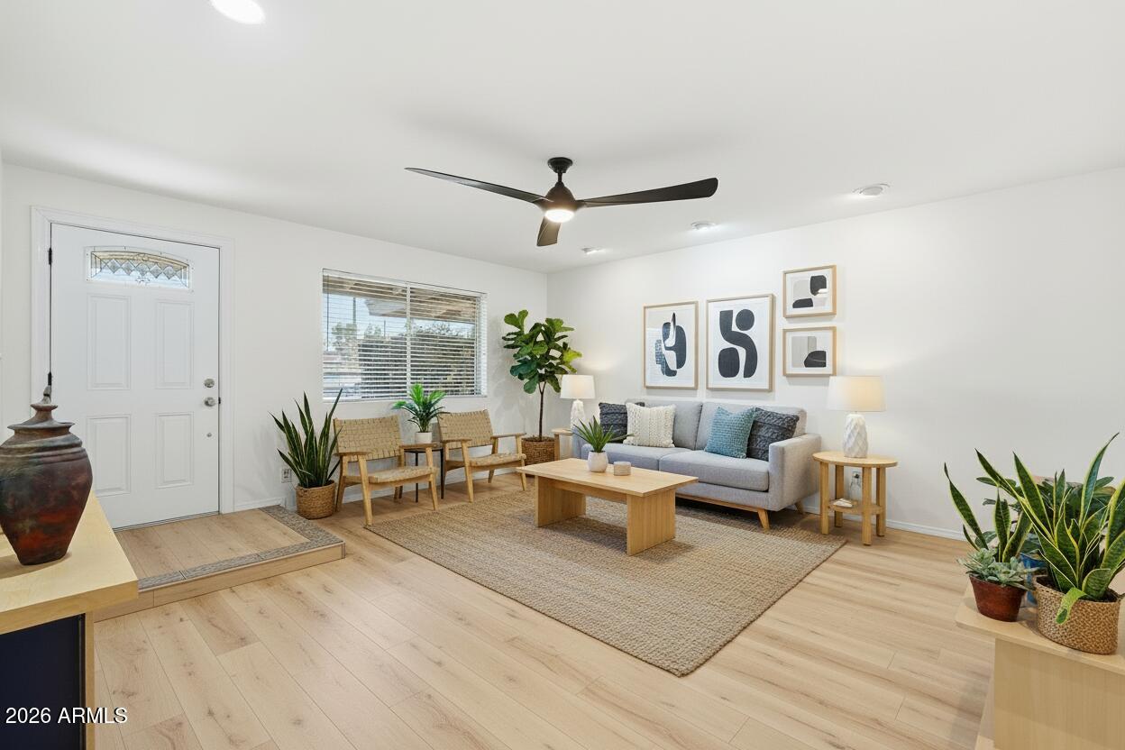 3830 East Shangri La Road Phoenix, AZ 85028 - Photo 8 of 53 a living room with furniture and a potted plant
