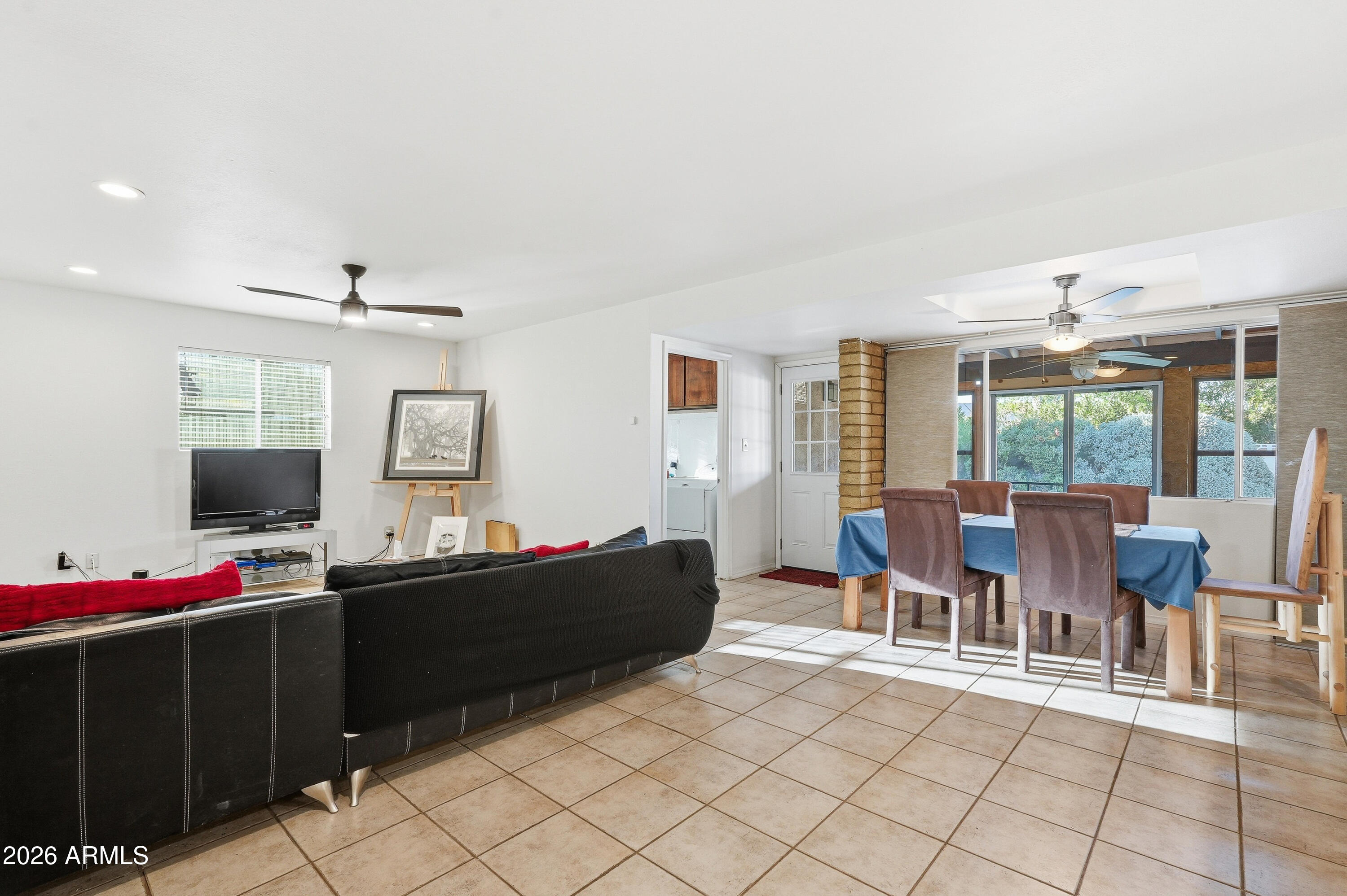 3830 East Shangri La Road Phoenix, AZ 85028 - Photo 10 of 53 a dining room with furniture and a flat screen tv