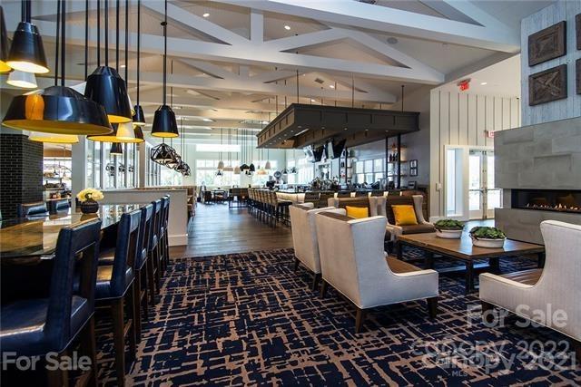 192 Flat Rock Drive Denver, NC 28037 - Photo 22 of 32 a living room with lots of furniture and a table