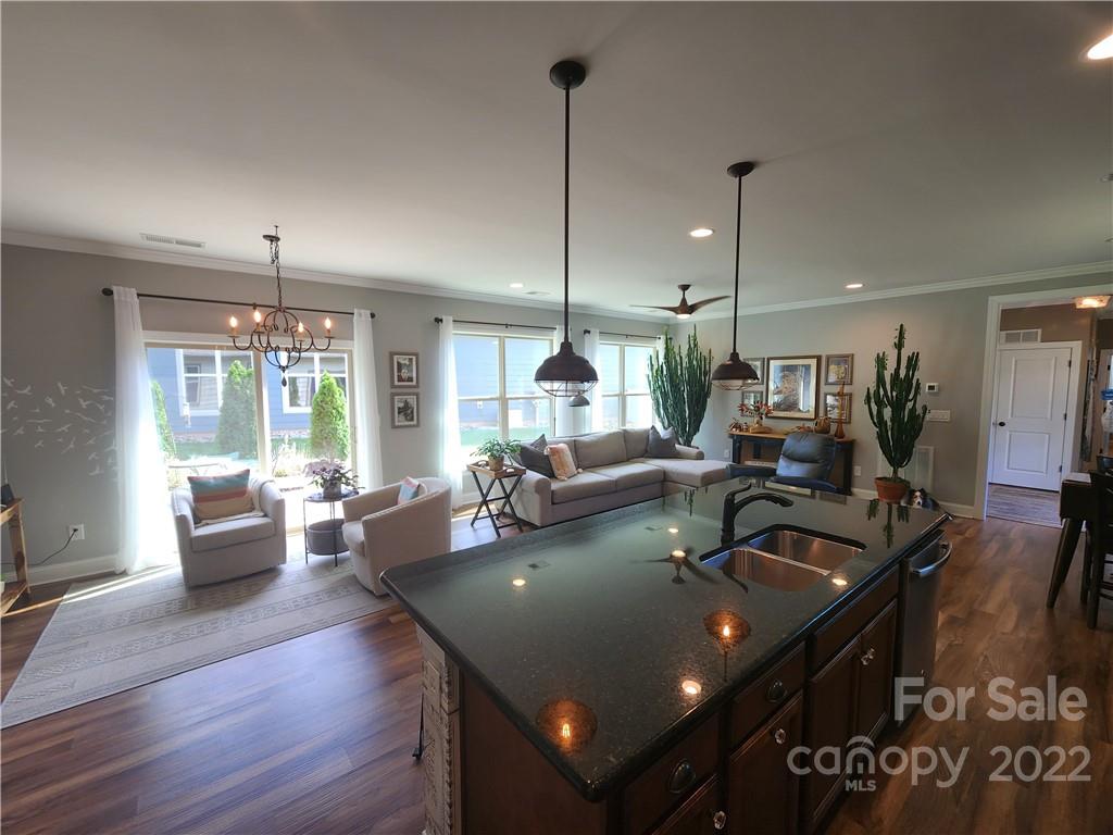 192 Flat Rock Drive Denver, NC 28037 - Photo 7 of 32 a view of a dining room with furniture window and wooden floor