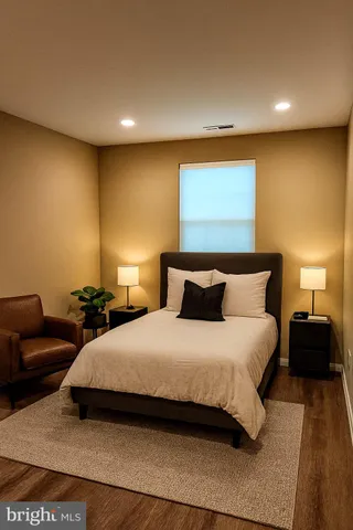 a bedroom with a bed and a couch