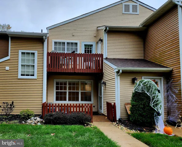 a view of front of house with a yard