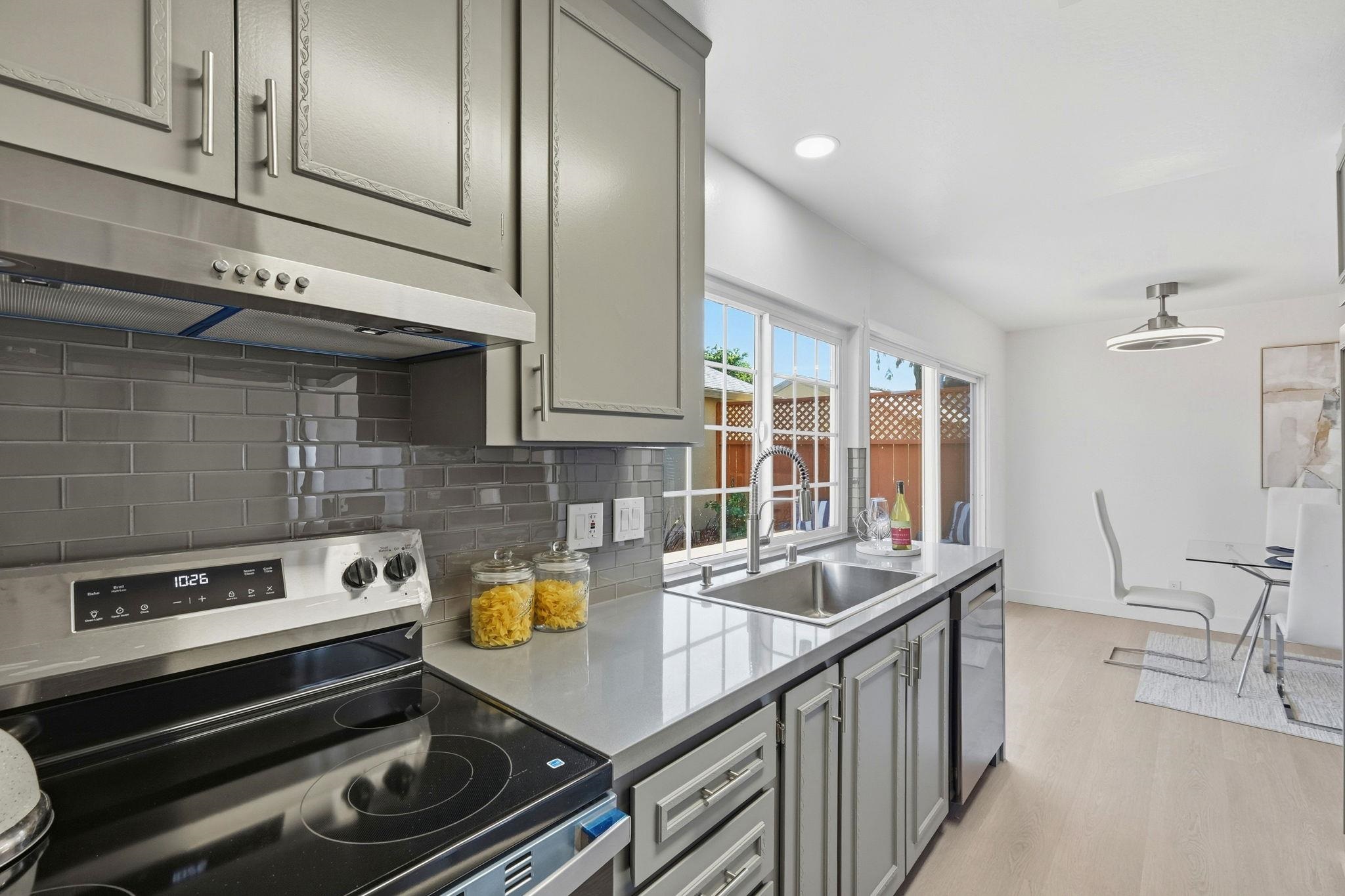 4290 Solar Circle Union City, CA 94587 - Photo 11 of 35 a kitchen with stainless steel appliances granite countertop a sink and a stove