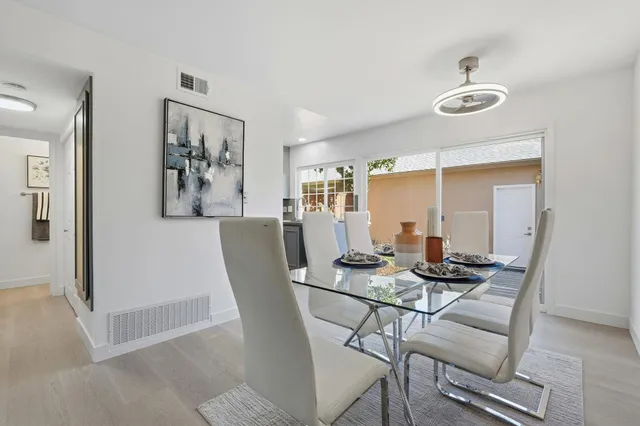 a dining room with furniture and window