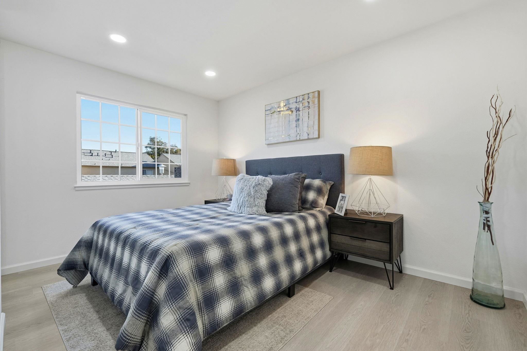 4290 Solar Circle Union City, CA 94587 - Photo 17 of 35 a bedroom with a bed and a night stand