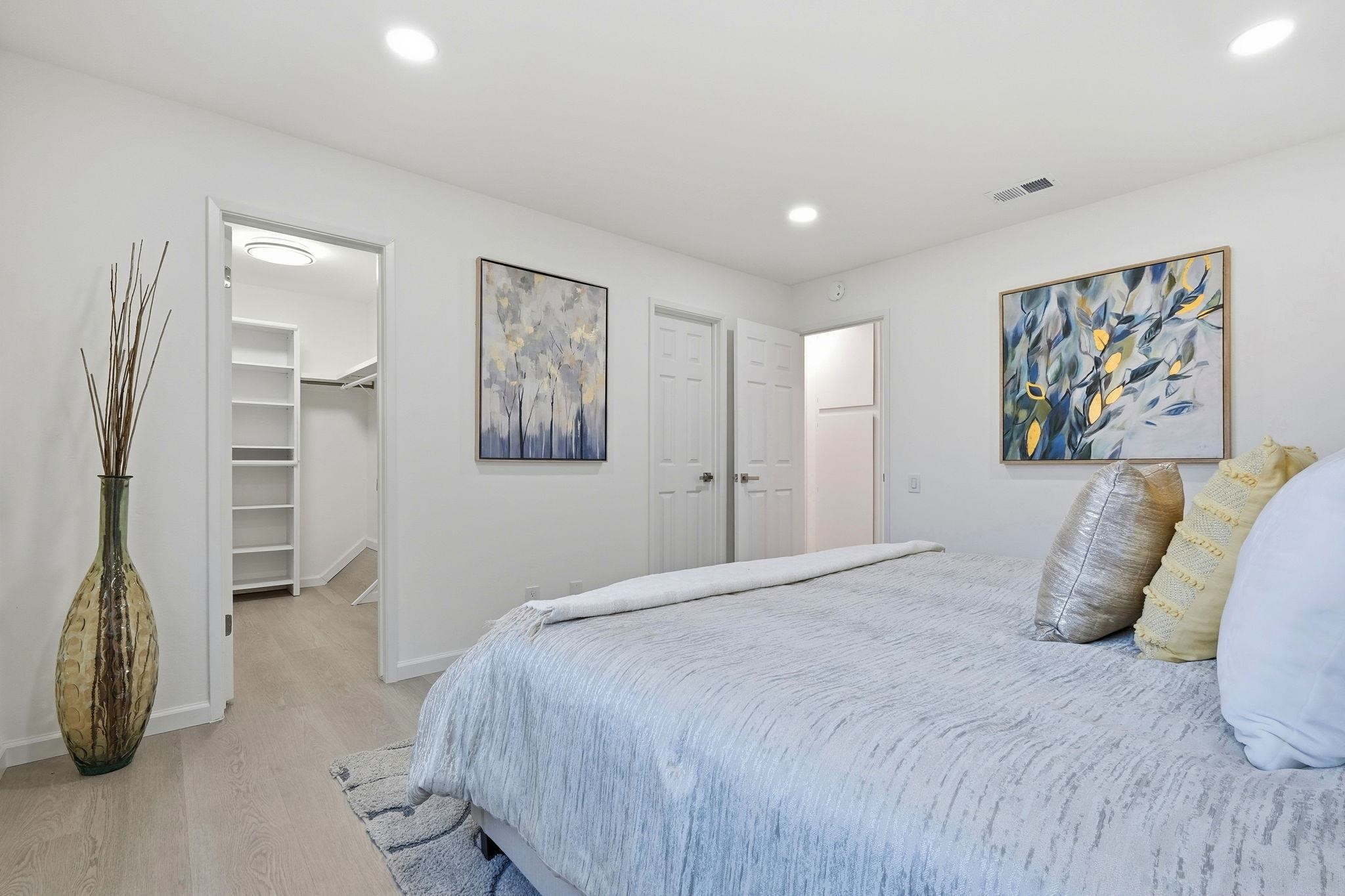 4290 Solar Circle Union City, CA 94587 - Photo 22 of 35 a spacious bedroom with a bed and a painting on the wall
