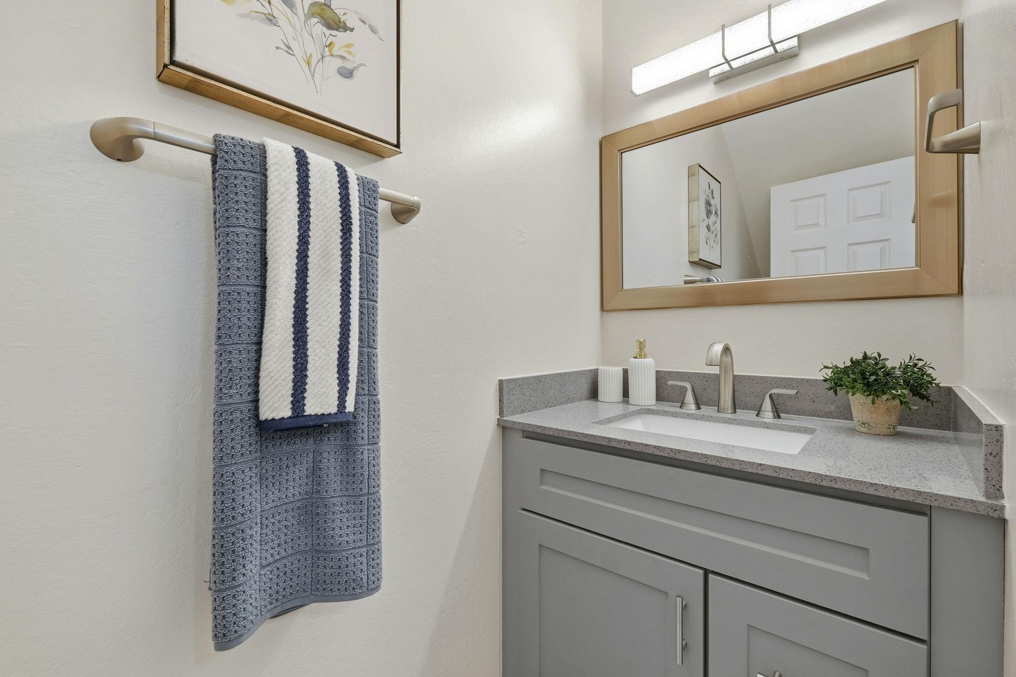 4290 Solar Circle Union City, CA 94587 - Photo 24 of 35 a bathroom with a granite countertop sink and a mirror