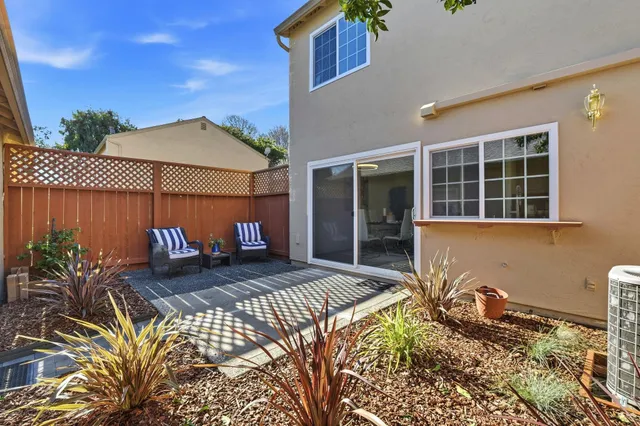 a view of a backyard with a sitting area