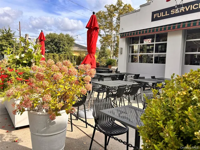 a view of a street with sitting area
