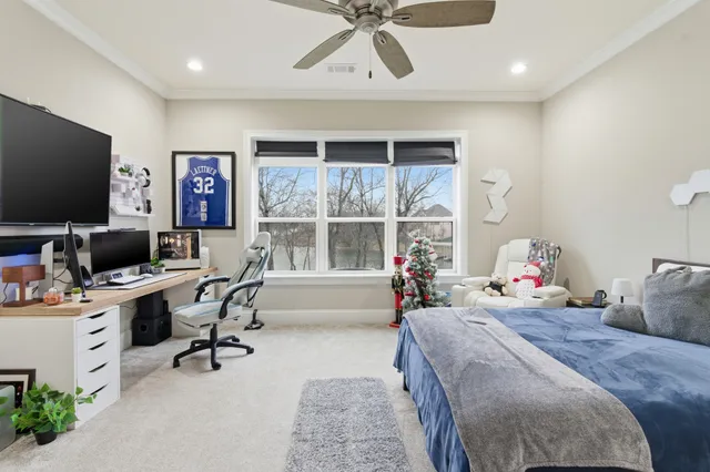 a bedroom with a bed and a chandelier