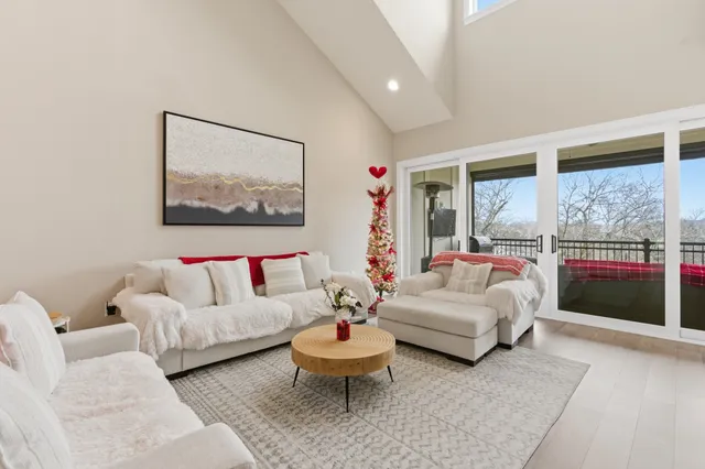 a view of a balcony furniture and rug