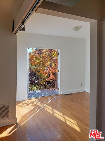 a view of a park with large trees