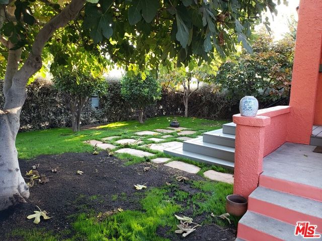 a view of a pathway with a yard