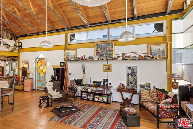 a view of a swimming pool with outdoor seating