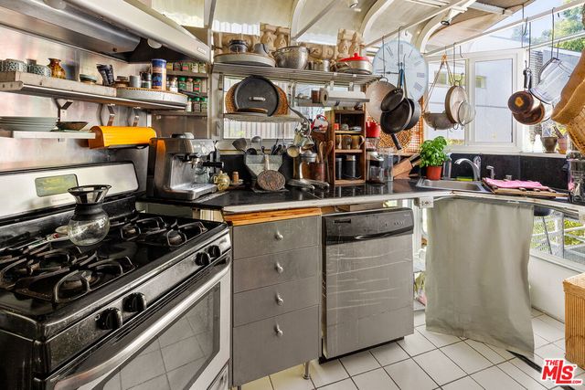 a kitchen with a stove and cabinets