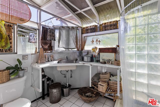 a room with wooden floor and furniture