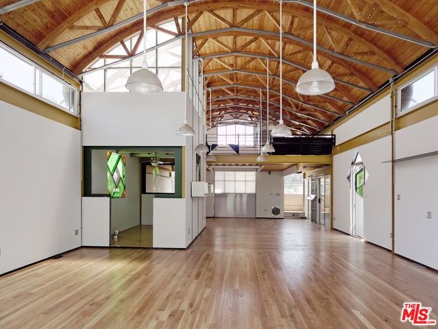 a view of an entryway with wooden floor