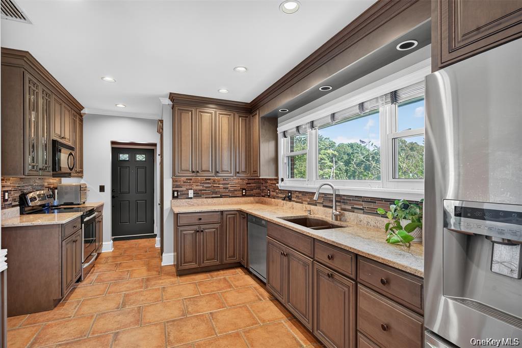 73 Old Balmville Road Newburgh, NY 12550 - Photo 11 of 25 a kitchen with a sink stove and refrigerator