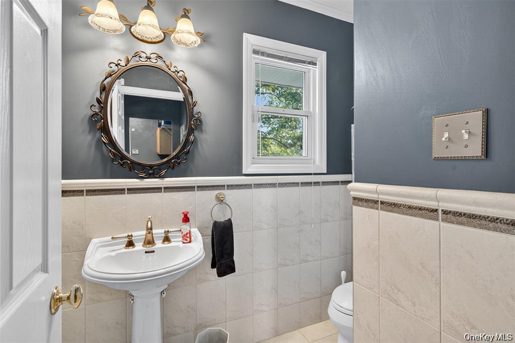 73 Old Balmville Road Newburgh, NY 12550 - Photo 13 of 25 a bathroom with a sink and a mirror
