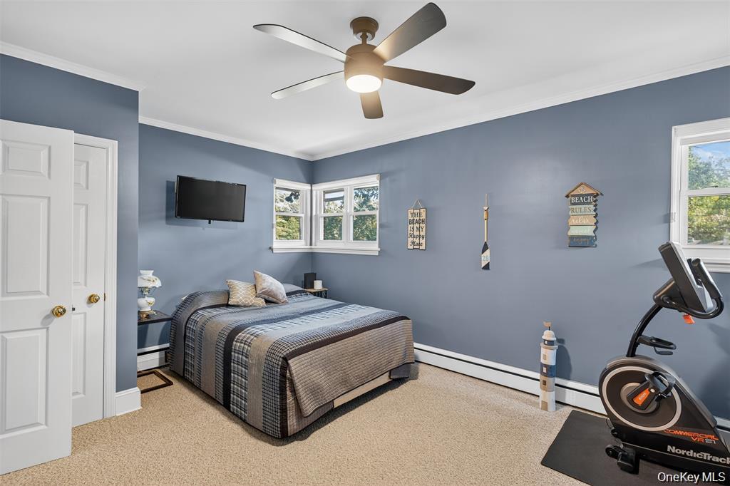 73 Old Balmville Road Newburgh, NY 12550 - Photo 15 of 25 a bedroom with a bed and a chandelier