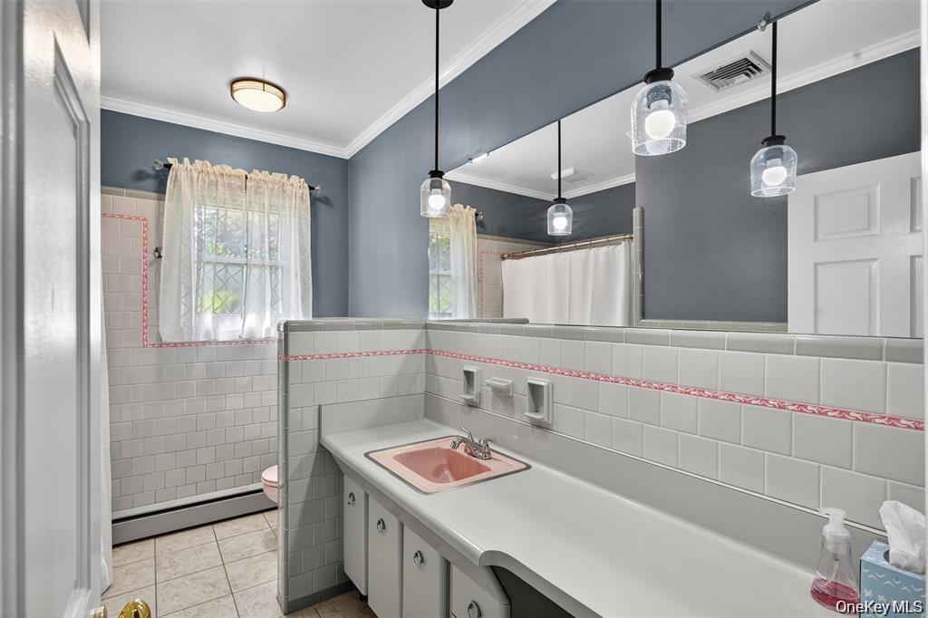 73 Old Balmville Road Newburgh, NY 12550 - Photo 16 of 25 a bathroom with a sink and a shower
