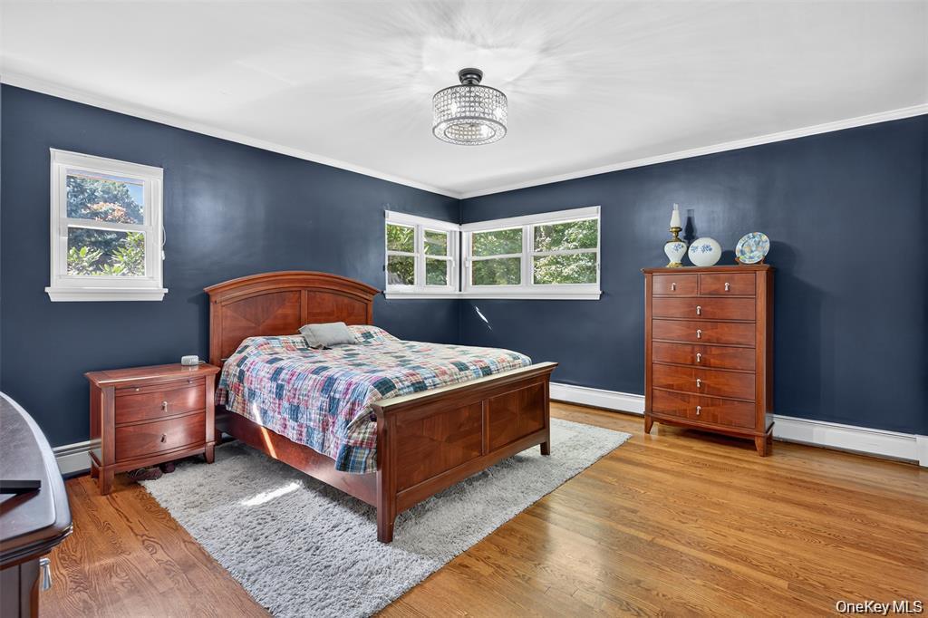73 Old Balmville Road Newburgh, NY 12550 - Photo 17 of 25 a bedroom with a bed and wooden floor