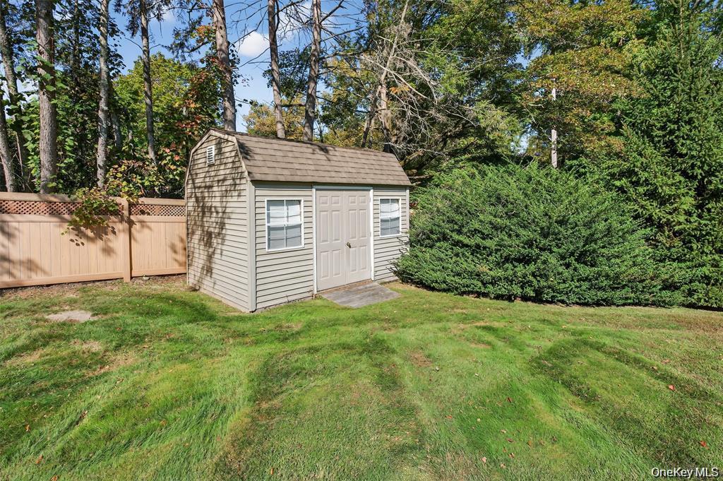 73 Old Balmville Road Newburgh, NY 12550 - Photo 20 of 25 a view of a yard in front of a house with a large tree