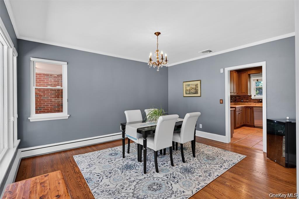 73 Old Balmville Road Newburgh, NY 12550 - Photo 7 of 25 a view of a dining room with furniture wooden floor and chandelier