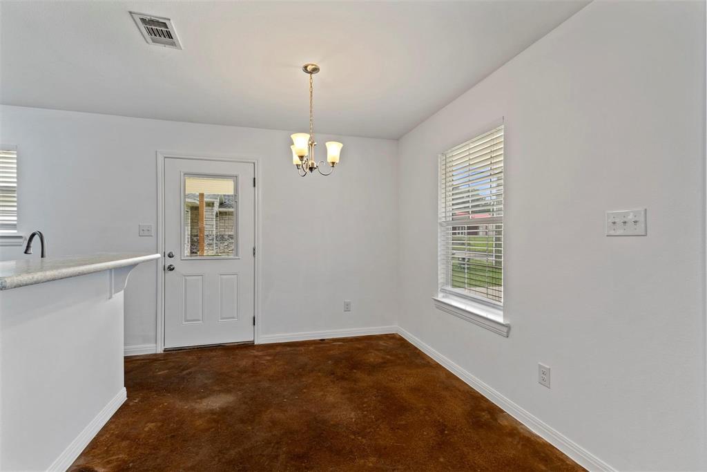 804 East 5th Street Bonham, TX 75418 - Photo 6 of 15 an empty room with windows
