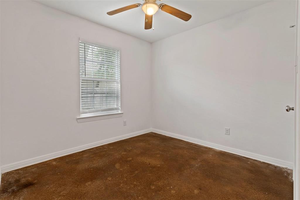 804 East 5th Street Bonham, TX 75418 - Photo 9 of 15 an empty room with a chandelier fan