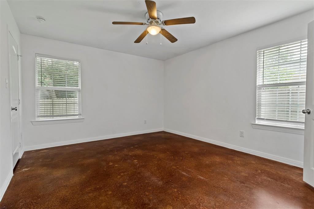 804 East 5th Street Bonham, TX 75418 - Photo 10 of 15 an empty room with a window and a fan