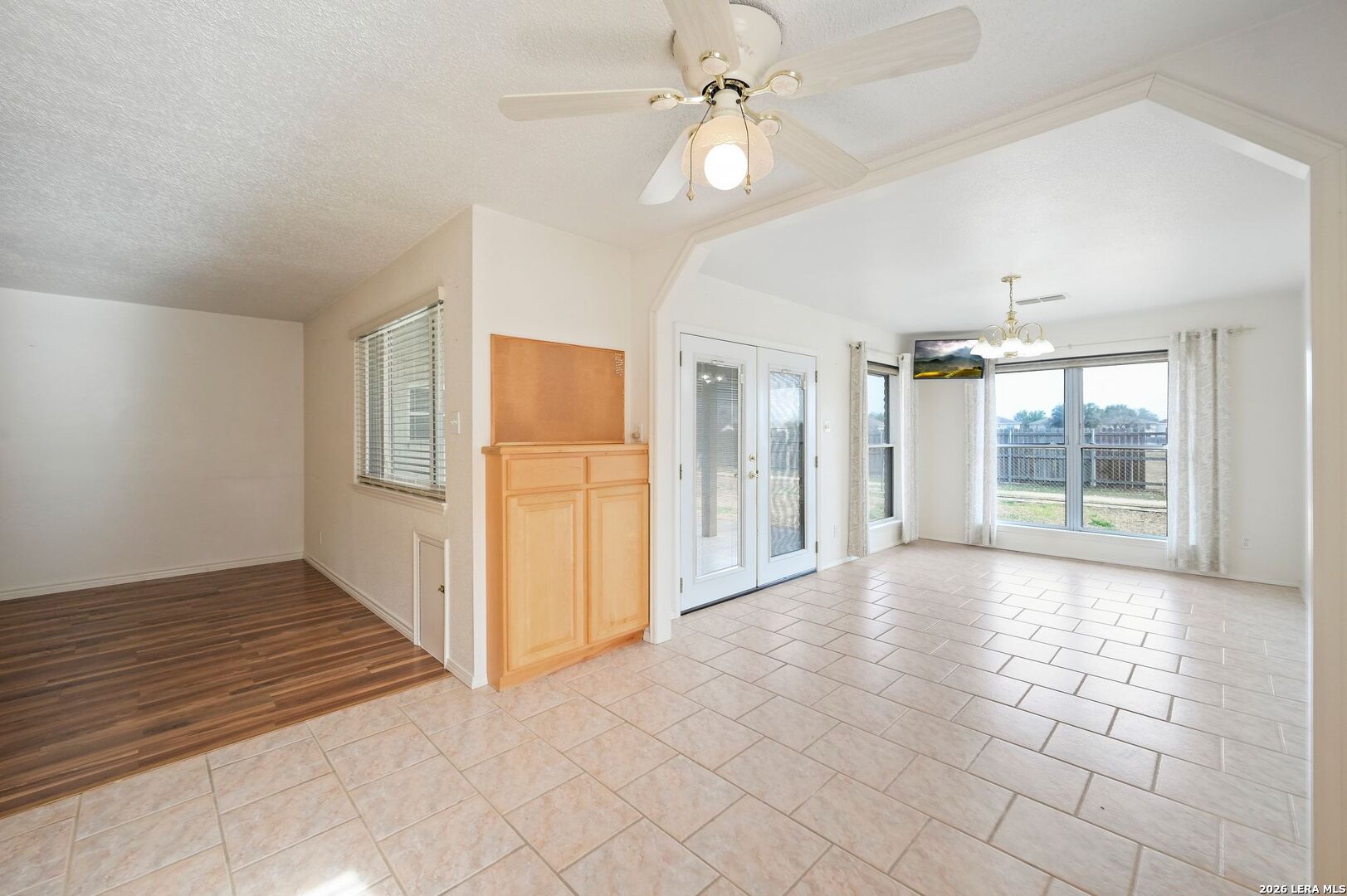 162 Oakside Universal City, TX 78148 - Photo 13 of 31 en empty room with windows and ceiling fan