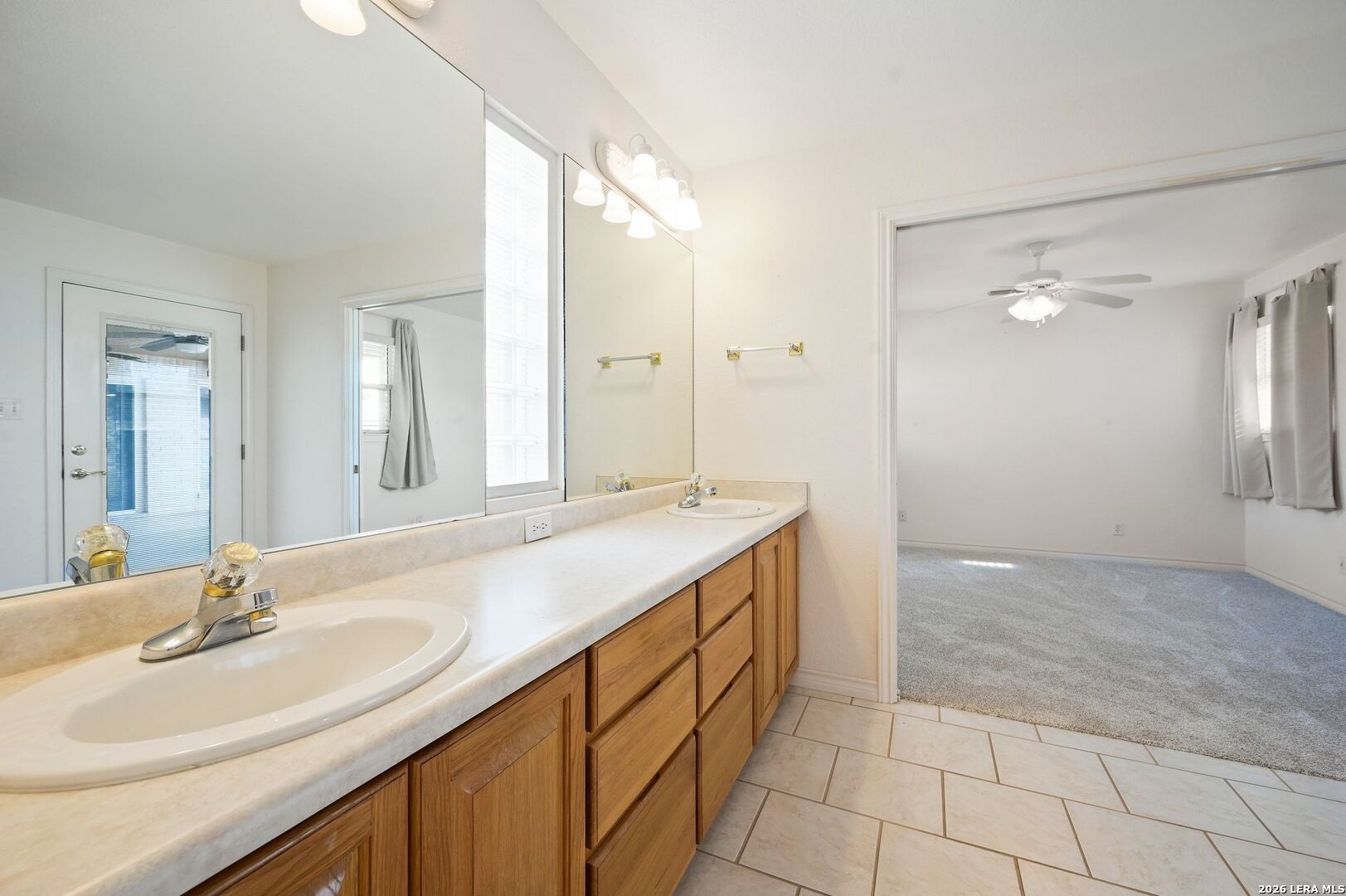 162 Oakside Universal City, TX 78148 - Photo 19 of 31 a bathroom with a sink double vanity and a mirror