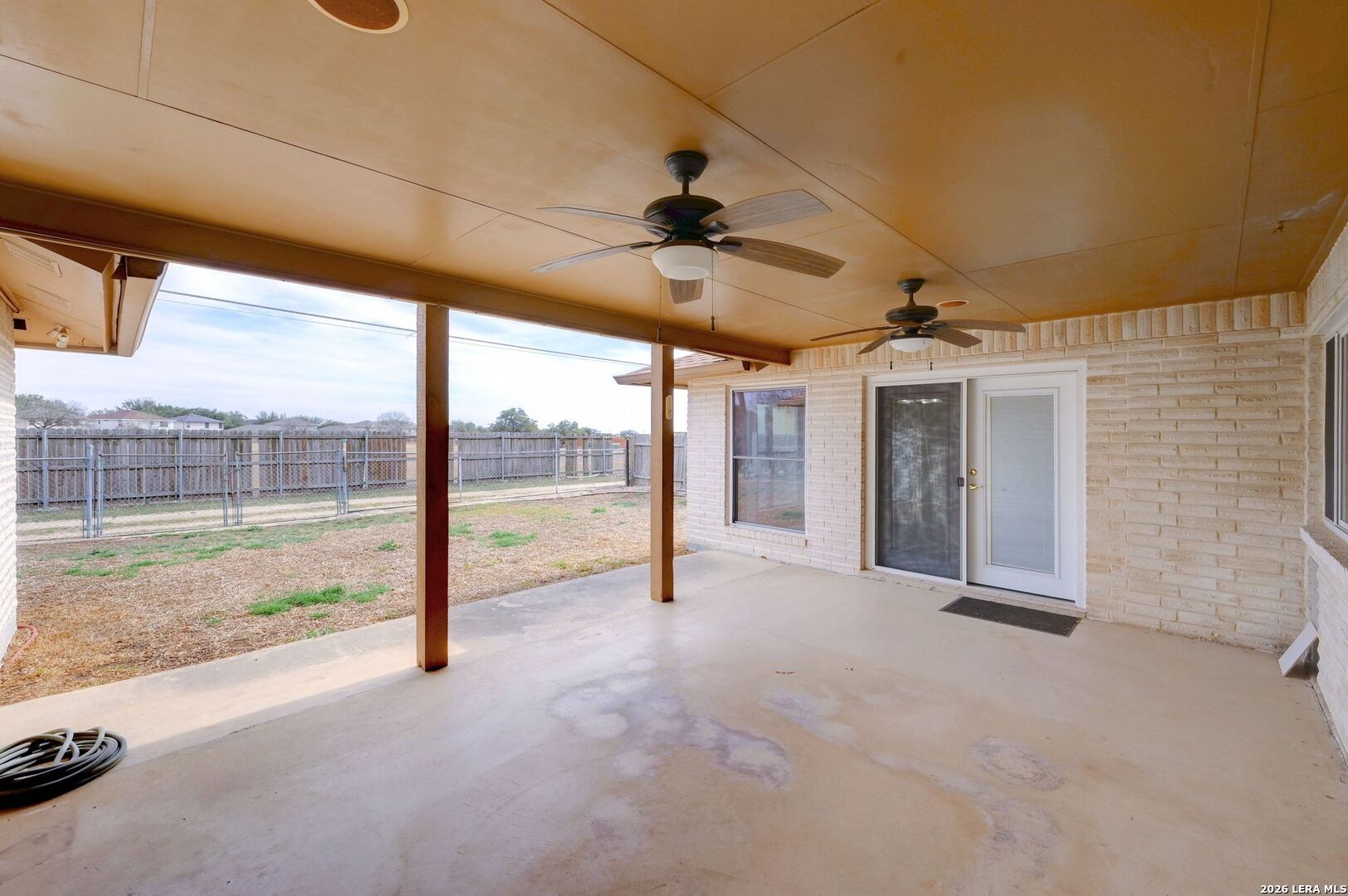 162 Oakside Universal City, TX 78148 - Photo 26 of 31 a view of an empty room with a sliding door