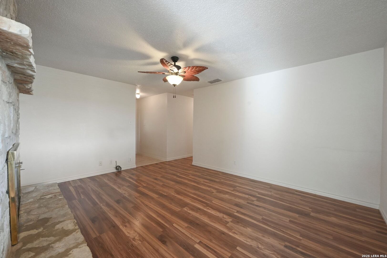162 Oakside Universal City, TX 78148 - Photo 6 of 31 a view of an empty room with wooden floor